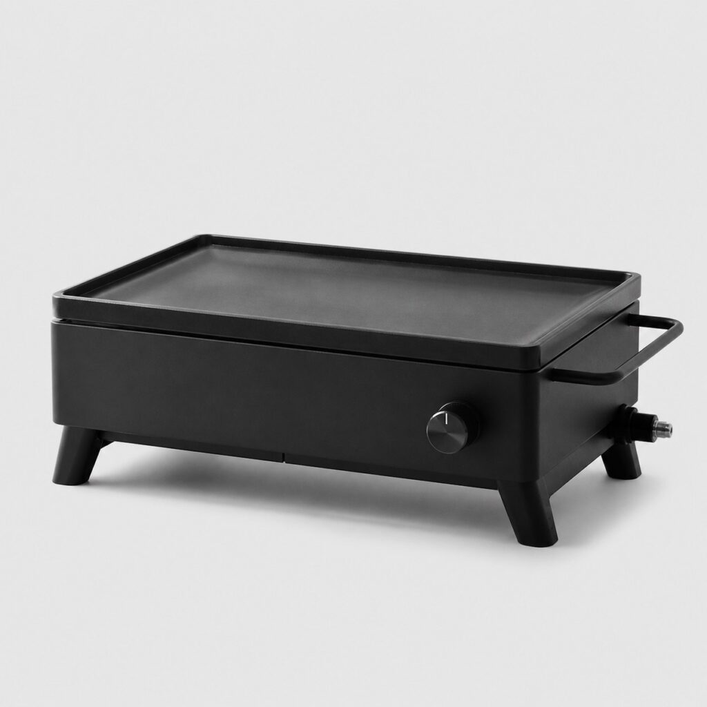 Plancha au gaz transportable à poignée et pieds repliables sur fond gris clair